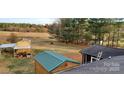 Large lot has barns and a shed plus plenty of room for outdoor enjoyment at 711 Burtonwood Ln, Lincolnton, NC 28092