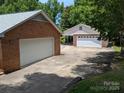 Multi car garages offering ample parking and storage at 8007 Caldwell Rd, Harrisburg, NC 28075