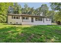 Beautiful white brick home with neat landscaping, offering a welcoming and classic curb appeal at 848 Ike Lynch Rd, Dallas, NC 28034