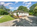 Well-maintained single-story home with a detached garage and spacious driveway at 1107 Fairfield Dr, Gastonia, NC 28054