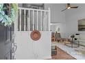 Bright foyer with staircase, coat rack, and view into the living room at 12524 Angel Oak Dr, Huntersville, NC 28078