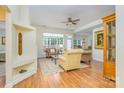 Bright living room featuring hardwood floors, large windows, and neutral decor at 13402 Mccoy Rd, Huntersville, NC 28078
