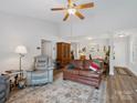 Bright living room with vaulted ceiling, ceiling fan, and open floor plan; warm and inviting for gatherings at 1836 Fairlawn Ct, Rock Hill, SC 29732