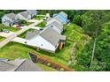 A high angle of a home's backyard and patio with landscaped garden at 18619 Mainsail Ct, Lancaster, SC 29720