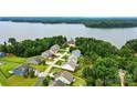 Aerial view of a lakeside community with lush greenery and beautiful waterfront homes at 18619 Mainsail Ct, Lancaster, SC 29720