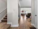 Inviting entryway with hardwood floors flowing into the living and kitchen areas, plus carpeted stairs at 237 River Clay Rd, Fort Mill, SC 29708
