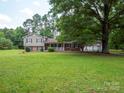 Charming two-story home with a welcoming front porch and well-maintained landscaping at 409 Ridge Rd, Clover, SC 29710