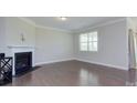 Inviting living room with hardwood floors, a fireplace, and ample natural light at 4333 Legacy Dr, Denver, NC 28037
