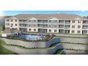 Upscale condominium exterior with a large swimming pool and lounge area surrounded by decorative landscaping at 4455 Reed Creek Dr # 101, Sherrills Ford, NC 28673