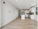 Open-concept living area with light wood flooring, neutral walls, recessed lighting and island kitchen at 4455 Reed Creek Dr # 101, Sherrills Ford, NC 28673
