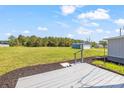 Large grassy backyard area with a deck to relax and enjoy the view at 5354 Sherrills Ford Rd, Catawba, NC 28609