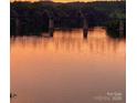 Scenic view of a bridge over the river at sunset reflecting on the water at 5888 Wood Duck Way, Catawba, NC 28609