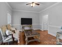 Bright living room with hardwood floors, elegant furniture, and a large window at 654 9Th N St, Albemarle, NC 28001