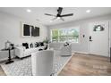 Bright living room with modern decor, hardwood floors, and large windows at 756 Logan St, Mooresville, NC 28115
