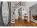 Bright foyer with hardwood floors, staircase, and traditional design elements, creating a grand entrance at 1310 Weddington Hills Dr, Matthews, NC 28104