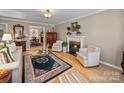 Elegant living room with a fireplace, hardwood floors, and comfortable seating, perfect for relaxation at 1634 - B Union Rd, Gastonia, NC 28054