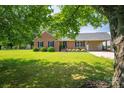 Beautifully maintained single-story brick home with a lush green lawn and charming curb appeal at 233 Reliance Rd, Kings Mountain, NC 28086