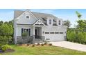 Beautiful two-story home with stone accents and a well-manicured lawn, perfect for curb appeal at 24578 Blue Heron Cir # 407, Lancaster, SC 29720