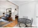 Bright bedroom with hardwood floors, ceiling fan, and neutral decor at 2607 Vail Ave, Charlotte, NC 28207