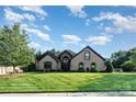 Well-maintained home exterior with a lush green lawn and manicured landscaping enhancing curb appeal at 3441 Club Ridge Ct, Gastonia, NC 28056