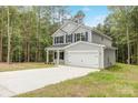 Charming two-story home with a two-car garage, black shutters, and a well-manicured front yard in a beautiful location at 4222 Acorn St, Charlotte, NC 28205