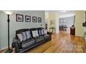 Inviting living room with hardwood floors, featuring stylish sofa, artwork, and decor at 488 Saint George Rd, Fort Mill, SC 29708