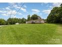 Well-maintained single-story home with a spacious front yard, offering a serene and inviting outdoor space at 828 Carver St # 17-19, Shelby, NC 28152