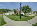 Attractive brick home exterior with a well-kept lawn, mature trees, and inviting curb appeal at 9226 Dunwich Dr, Gastonia, NC 28056