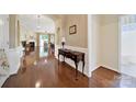 Elegant entryway boasting hardwood floors, decorative console table, and arched doorways leading to the home's inviting spaces at 964 Knob Creek Ln, Fort Mill, SC 29708