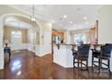 Spacious kitchen featuring wooden floors, countertops, white walls and modern appliances perfect for cooking and entertaining at 964 Knob Creek Ln, Fort Mill, SC 29708