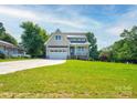 Attractive single Gathering home with a well-manicured lawn and attached garage at 102 Starmount Dr, Kings Mountain, NC 28086