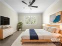 Staged main bedroom features a ceiling fan, large window, and comfortable furnishings at 103 Margo Ln, Statesville, NC 28677