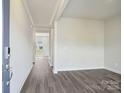 Spacious entryway featuring hardwood floors, white walls and trim, and views into other rooms at 1217 Morehead Dr, Salisbury, NC 28144