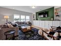 Bright living room featuring large windows, built-in shelves, and a modern entertainment area at 1315 Elizabeth Ave, Kannapolis, NC 28083