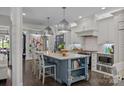 Stylish kitchen with a large island, stainless steel appliances, granite countertops, and custom cabinets at 19506 Mary Ardrey Cir, Cornelius, NC 28031
