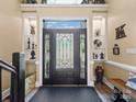 Elegant foyer with a decorative front door and recessed shelving with decorative items at 2769 Independence Way, Gastonia, NC 28056