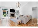 Bright and airy living room with a fireplace, hardwood floors, and a comfortable seating area at 3622 46Th Ne Ave, Hickory, NC 28601