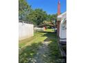 The long gravel driveway leads past a shed and covered parking area at 408 Moose St, Albemarle, NC 28001
