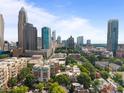 Panoramic aerial view of a city showcasing the skyline and surrounding greenery at 415 N Church St # 311, Charlotte, NC 28202