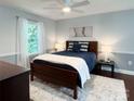Serene main bedroom with a plush bed, soft lighting, and a large window offering natural light and views at 9305 Harps Mill Ct, Charlotte, NC 28270