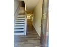 Inviting entryway showcasing beautiful floors and a staircase at 10416 Audubon Ridge Dr # 4, Cornelius, NC 28031