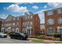 Well-maintained brick townhome featuring stylish architectural details and a quaint balcony at 11123 Waxberry Dr, Charlotte, NC 29277