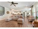 Inviting living room showcases hardwood floors, neutral tones, and open floor plan to dining and kitchen at 11313 Limehurst Pl, Charlotte, NC 28278