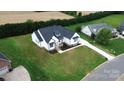 Overhead view of a home on a large grassy lot with a circular driveway at 115 Augusta Ln, Shelby, NC 28150