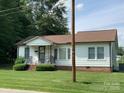 A well-maintained single-story home featuring classic architecture and a lovely green lawn at 1721 9Th Ne Ave, Hickory, NC 28601