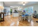 Bright kitchen with stainless steel appliances, white cabinets, and an adjacent dining area at 2043 Shadwell Ct, Gastonia, NC 28056