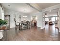 Elegant dining room featuring hardwood floors, wainscoting, and a stylish chandelier at 230 Yale Pl, Fort Mill, SC 29707
