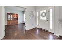 Warm foyer with hardwood flooring, a decorative wall piece, and views into other rooms at 230 Yale Pl, Fort Mill, SC 29707