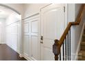 Bright entryway featuring detailed trim work, wood floors, and staircase at 2405 Emma Grace Ln, Rock Hill, SC 29732