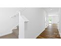 Bright entryway with wood-look flooring, white trim, and a carpeted staircase at 3136 Ora Smith Rd, Lincolnton, NC 28092